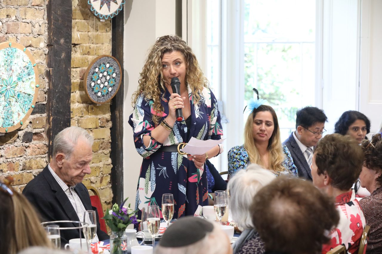 Louisa Clein, second generation survivor and previous Emmerdale actress, speaks at the event