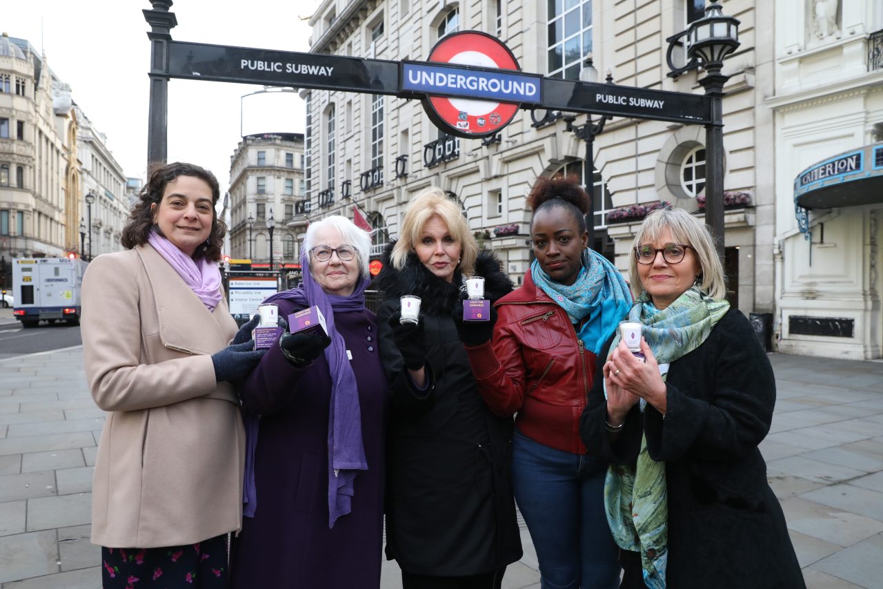 Olivia Marks Woldman OBE, Joan Salter MBE, Dame Joanna Lumley, Antoinette Mutabazi and Laura Marks OBE give out commemorative HMD candles in Central London on the morning of HMD