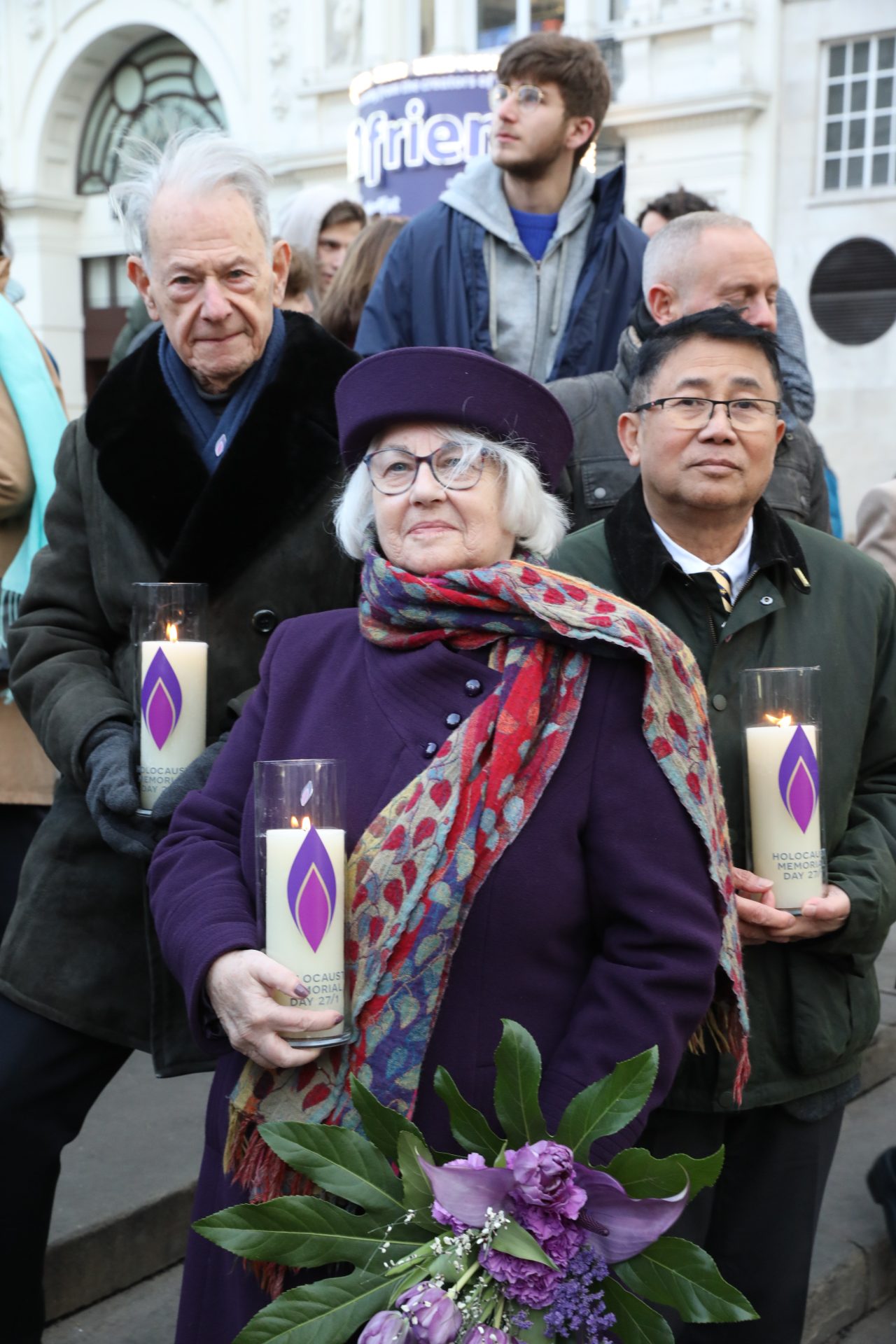 Holocaust survivors Joahn Hajdu MBE and Joan Salter MBE, Light the Darkness in Piccadilly with Sokphal Din BEM, a survivor of the genocide in Cambodia