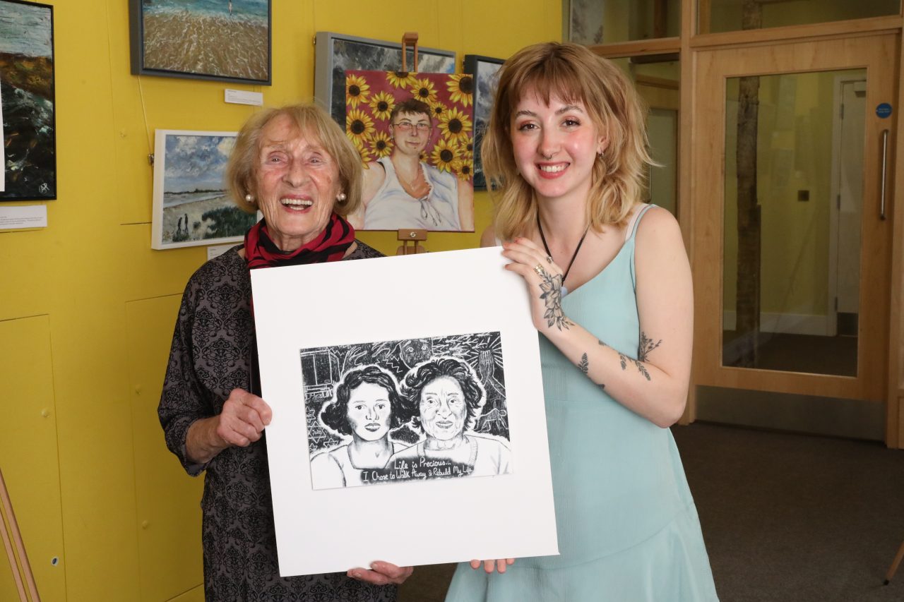 Susan Pollack MBE with Ellie Ball, who created a portrait of Susan