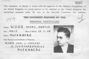 An image of Henry Wuga's identity card, with a headshot of Henry and his personal details entered by hand