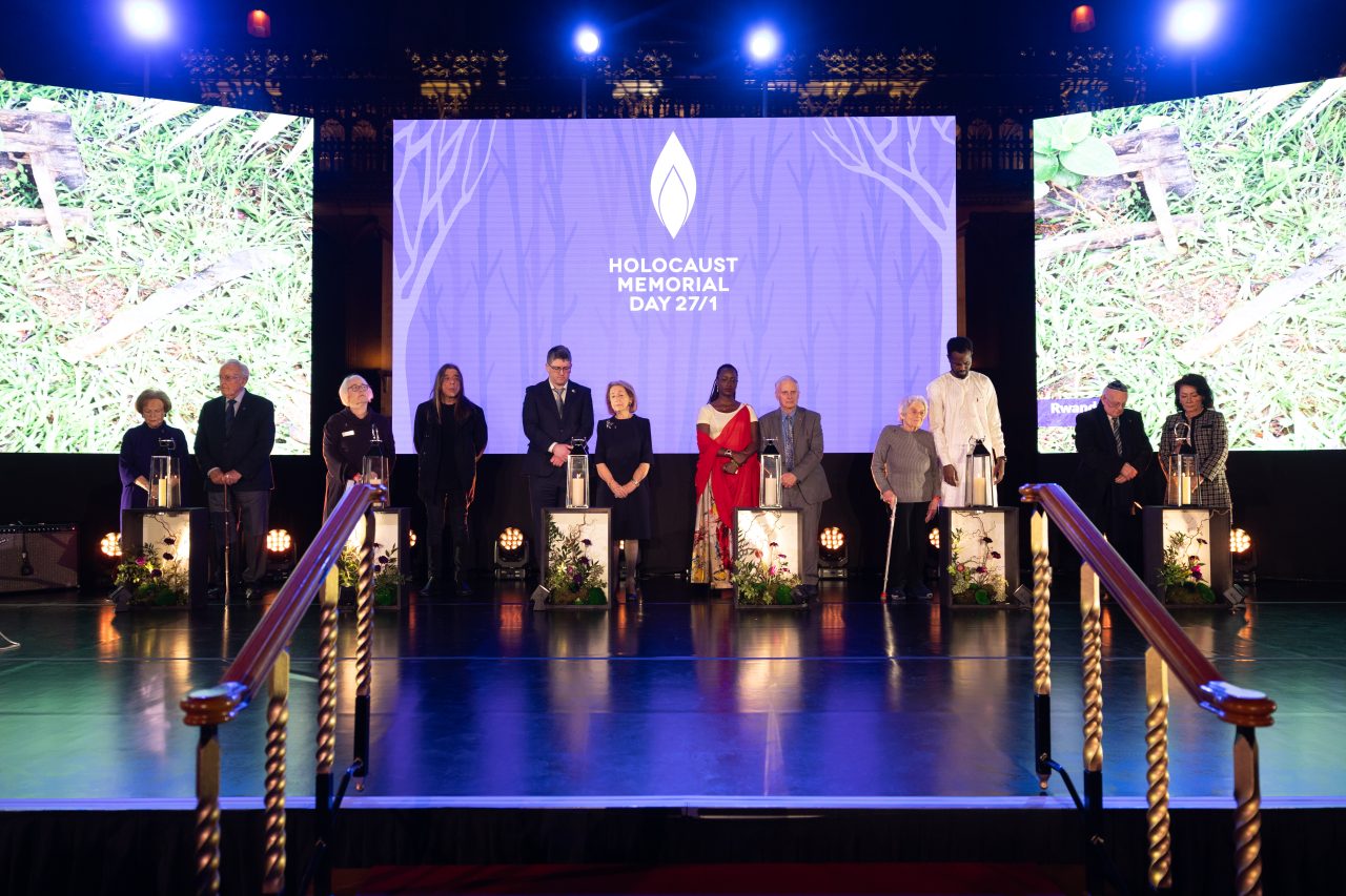 Survivors of the Holocaust and genocides light candles at the HMD 2024 UK ceremony  The Holocaust Memorial Day Trust / Sam Churchill